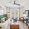 living room with a couch and large windows