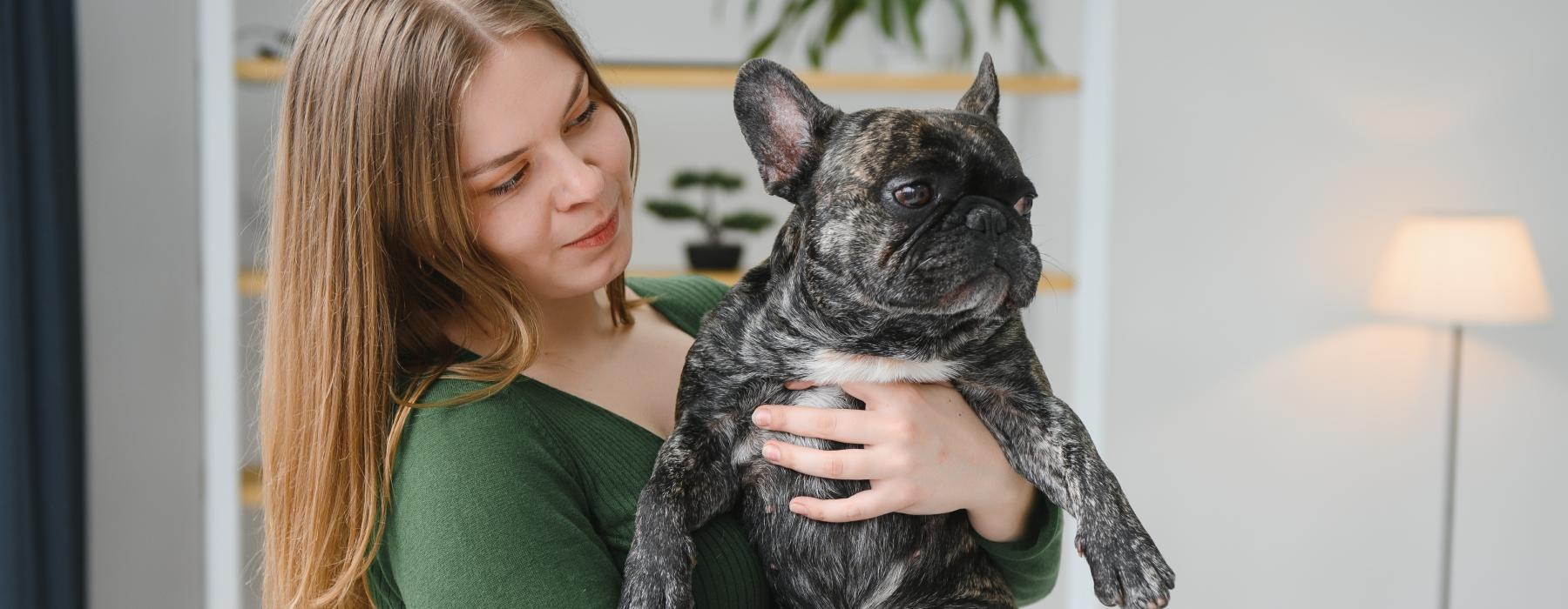 a woman holding a cat