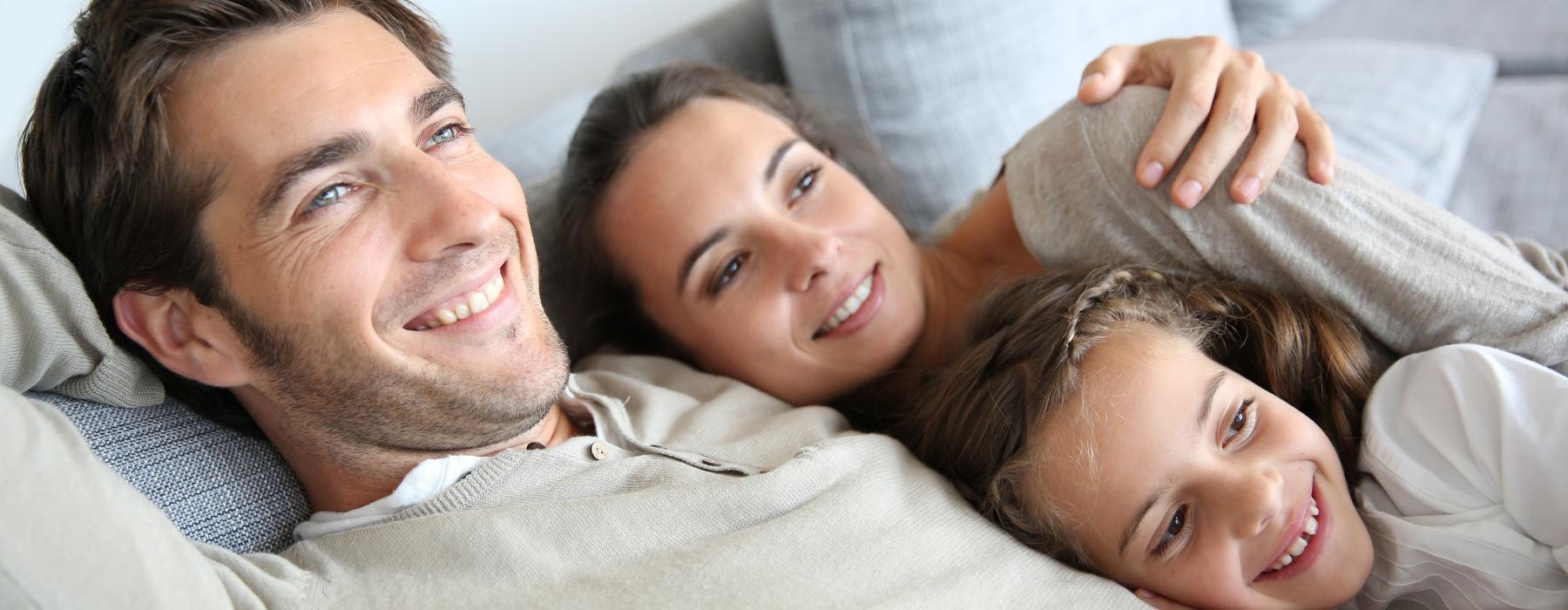 a man and a woman lying on a bed